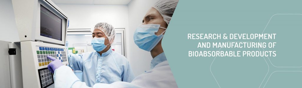 Research & Development and Manufacturing of Bioabsorbable Products - two technicians operating a machine
