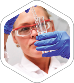 Researcher pipetting liquid into a test tube